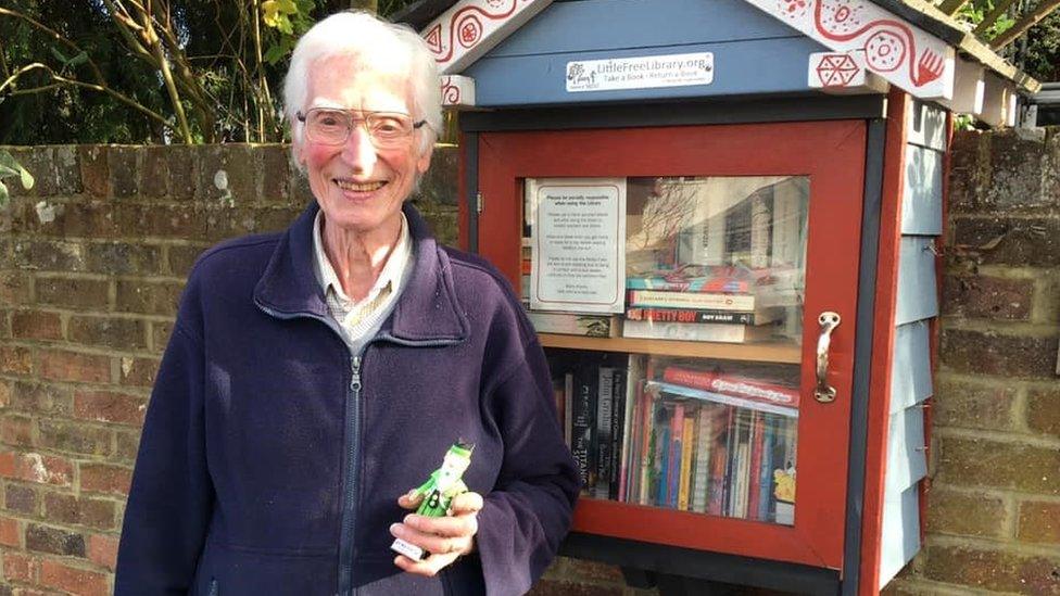 John Wheeler outside the Little Free Library in Milehouse Lane, St Albans