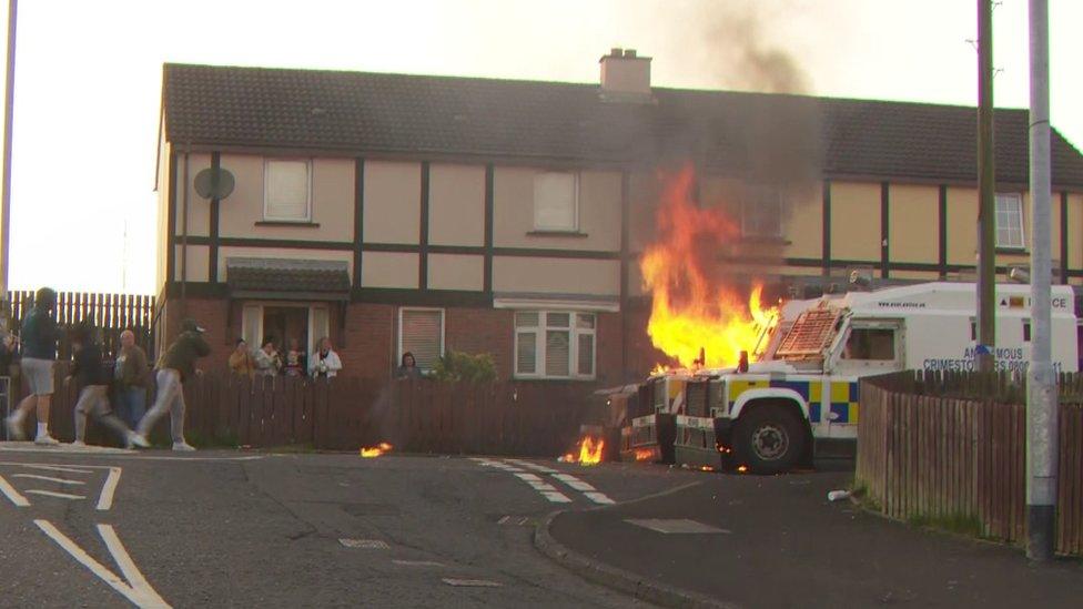 Police being attacked with petrol bombs in the Creggan