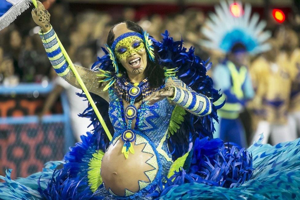 A member of Portela samba school performs during the first night of 2020 Rio's Carnival Parades at the Sapucai Sambadrome on 23 February.