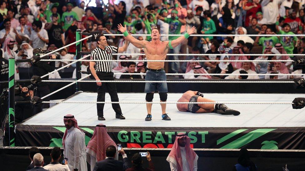 John Cena celebrates in the ring during Friday's Greatest Royal Rumble in Jeddah