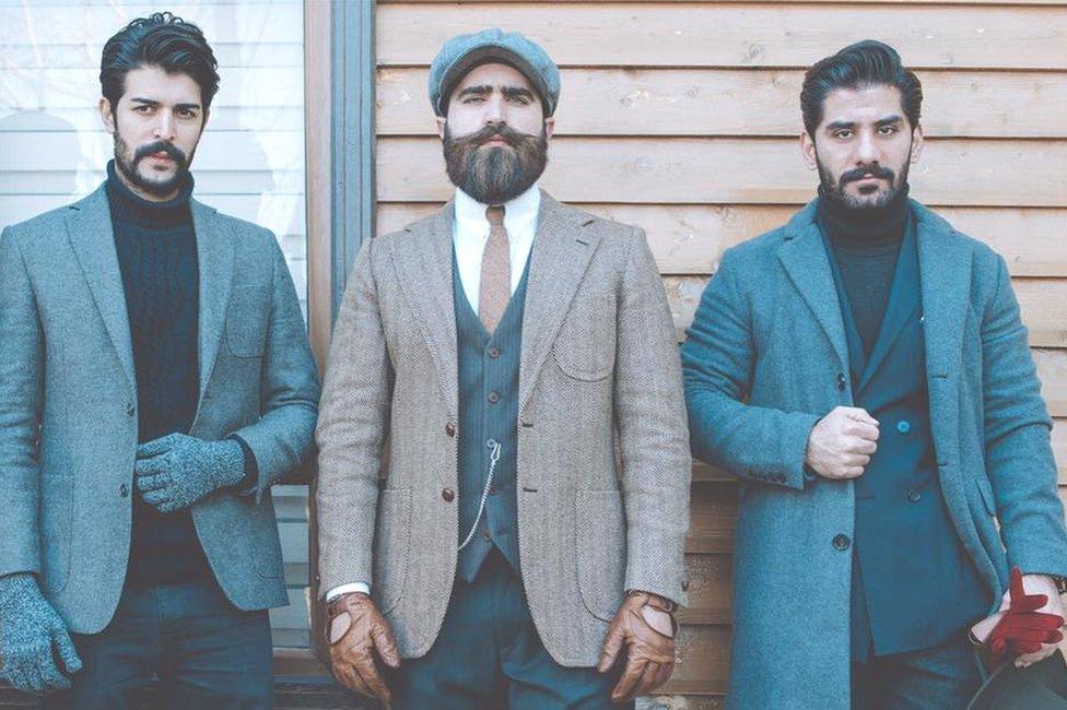 Iraqi men posing in suits