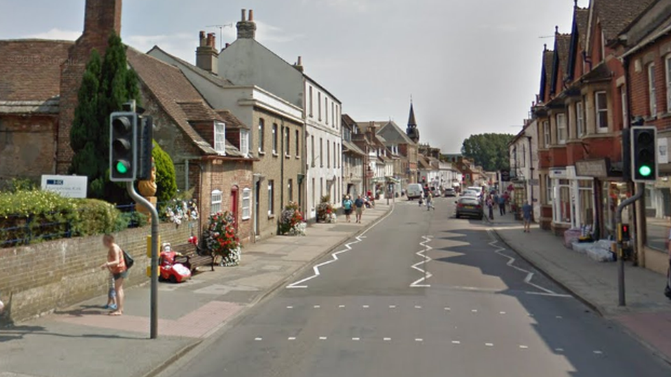 Crash location at North Street, Wareham - showing tributes to Jaiden on a bench on the left