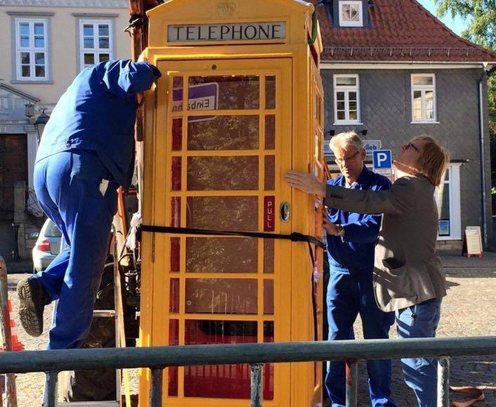 Phone box being moved into place