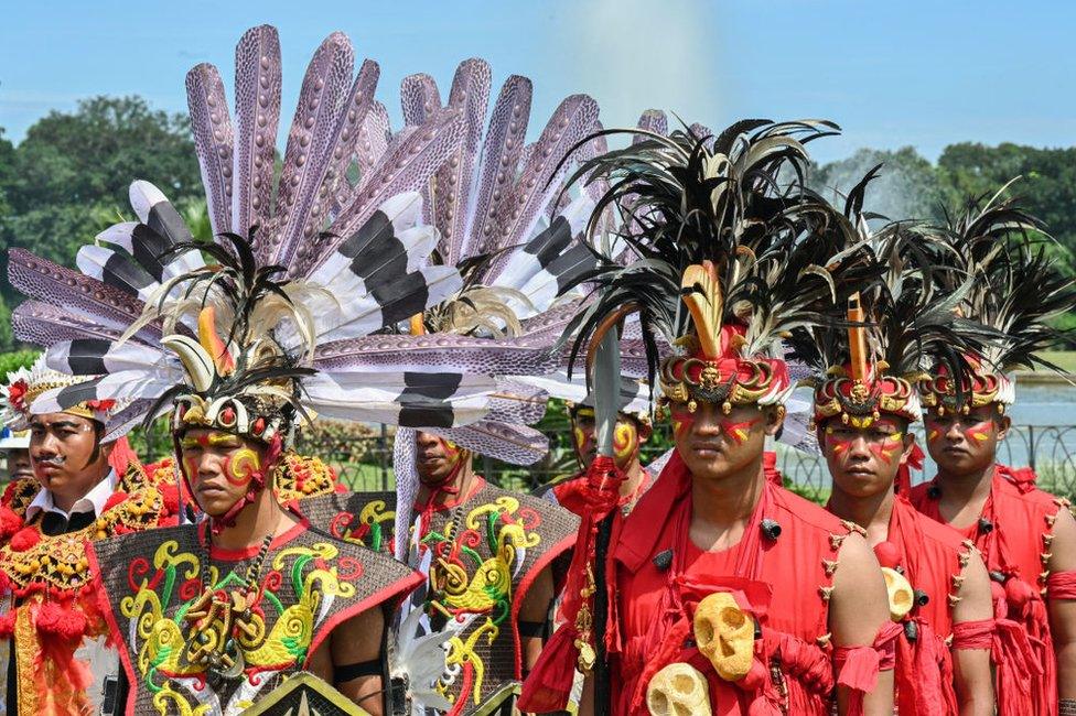 Indonesian guards wear traditional costumes.