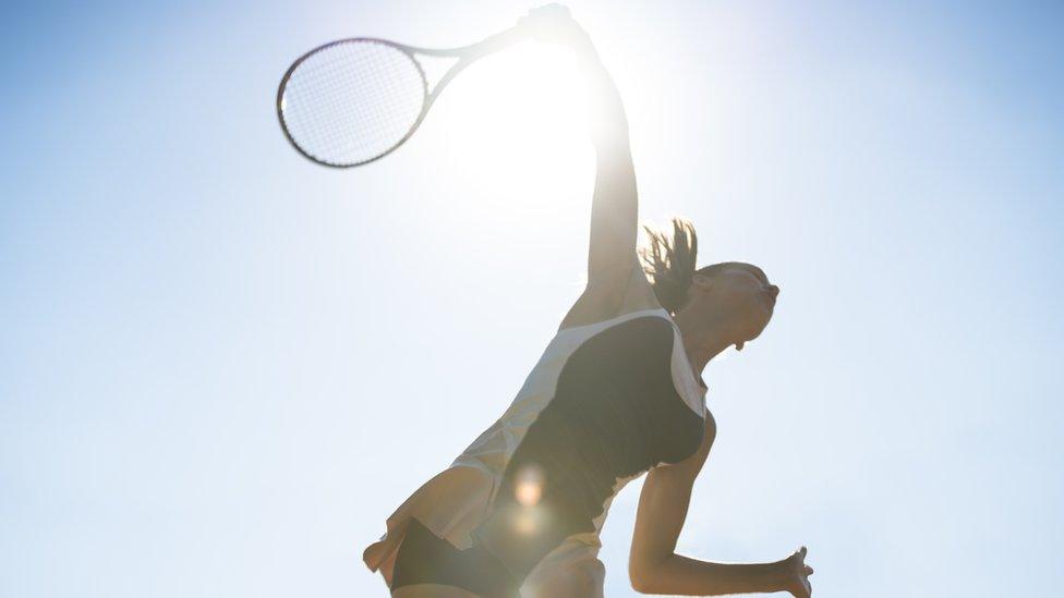 Woman playing tennis