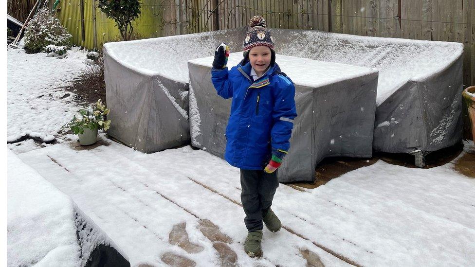 Boy playing in snow