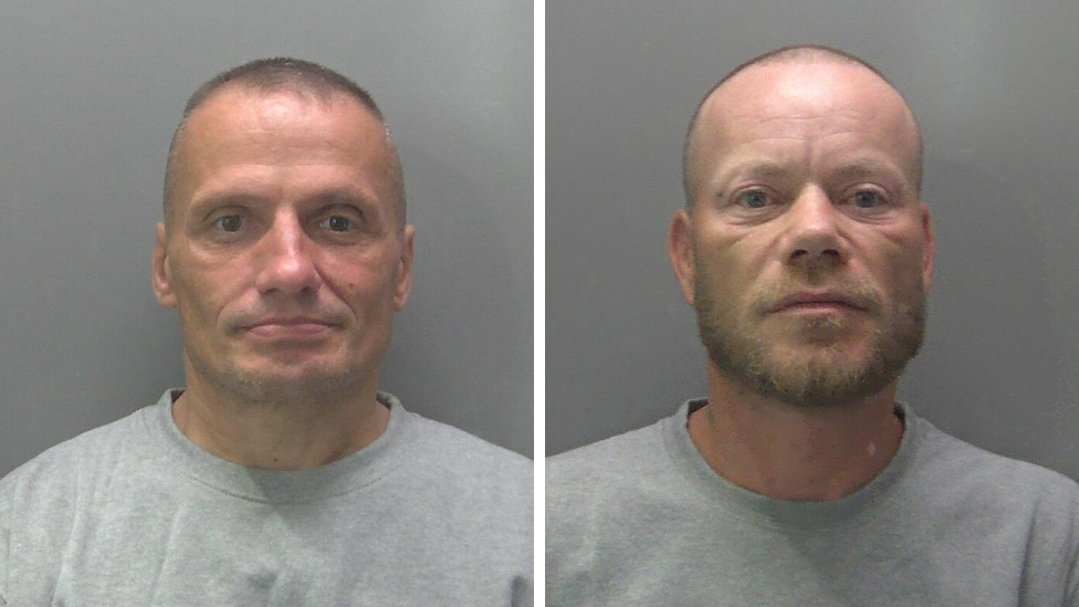 Composite images show the custody photos of Cojocario and Costache. Both men are wearing grey jumpers and are against plain grey backgrounds. They both have very short hair and Costache has a beard.