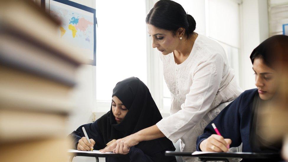 Girls studying in classroom