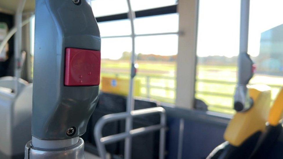 A bus stop button on a bus