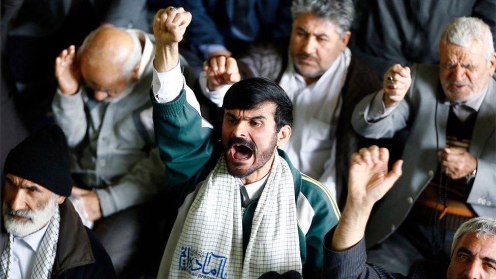 Iranians shout anti-US slogans after the Friday prayer ceremony in Tehrand