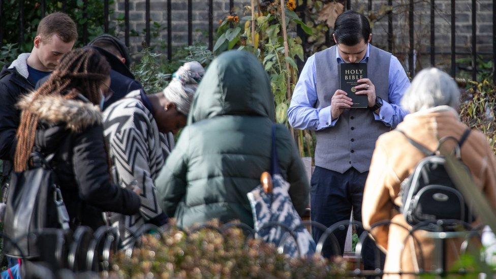 Pastor Regan King holds a church service outside the Angel Church