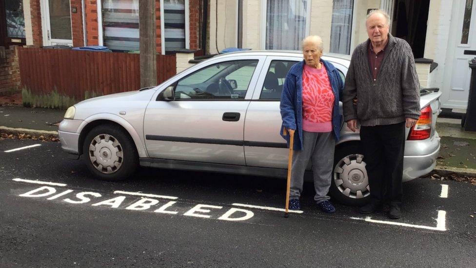 Maria and Brian Bishop by their disabled bay