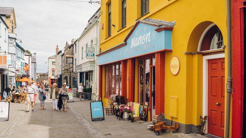 The front of Llety Arall hostel, bright yellow wall