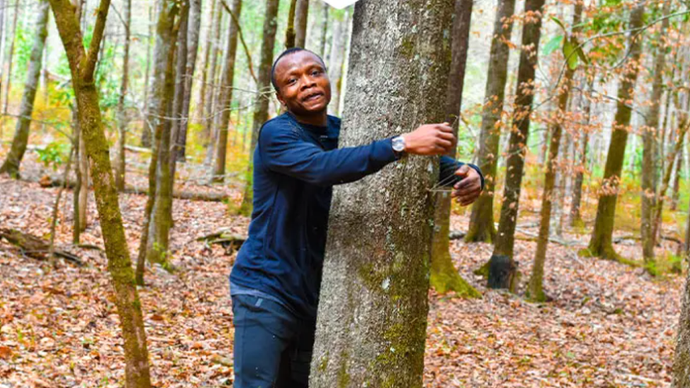 Tahiru hugging a tree