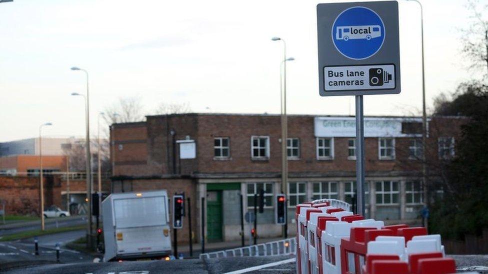 A road sign warning motorists of a bus lane camera