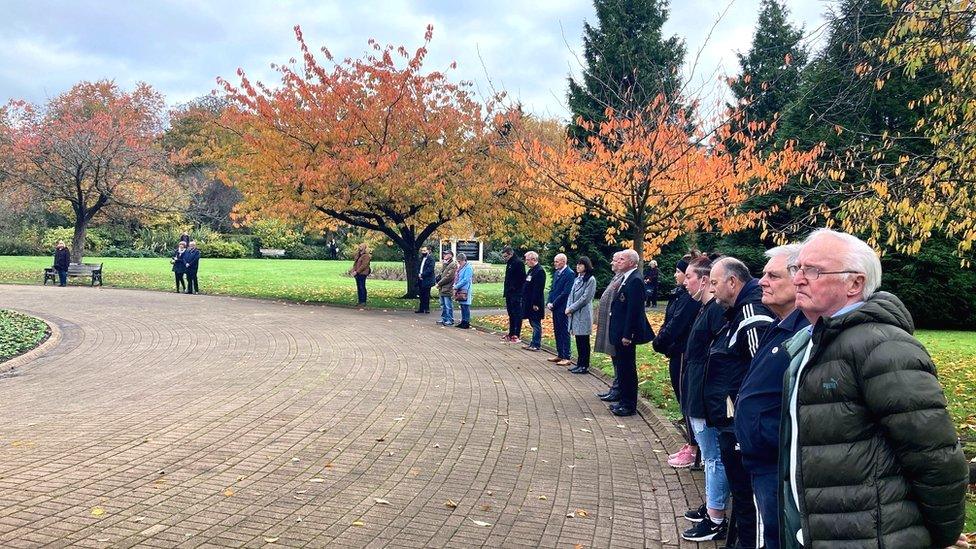 People standing in silence