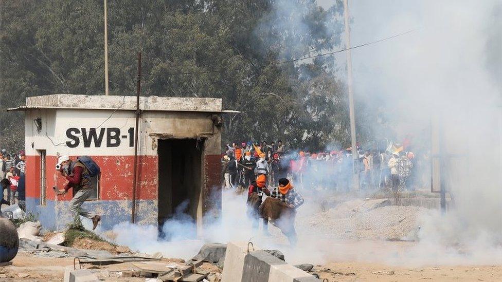 Haryana police throw teargas on the protesting Punjab farmers to prevent them moving towards Delhi at Shambhu Haryana Punjab border, 250 kilometers from Delhi, India, 13 February 2024.