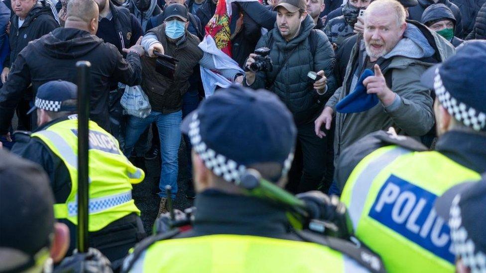 Counter-protesters clash with police in Parliament Square in central London during pro-Palestinian protest march