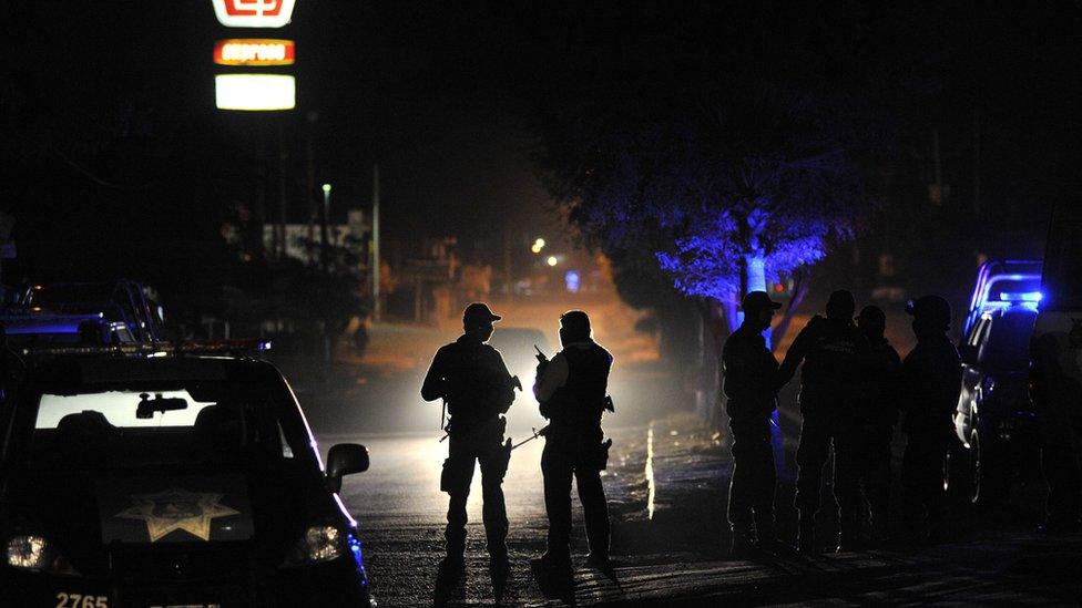 Members of the Mexican Army and Federal police patrol a crime scene after an organized crime shooting at the Villa Juarez neighbourhood in Navolato, State of Sinaloa on 7 February, 2017