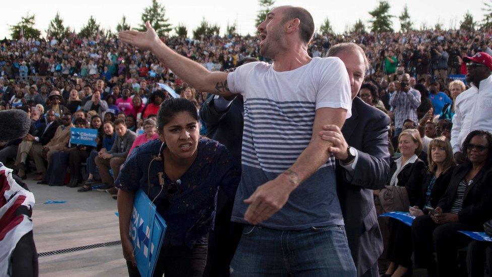 A protesters yells as US President Barack Obama speaks during a Hillary Clinton campaign rally in Greensboro, North Carolina. 11 October 2016