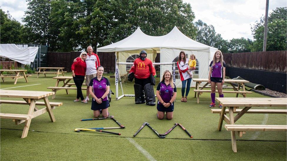 Philip Taylor with his partner Lynda, daughter Tanya and his grand-daughter with members of the Loddon ladies hockey team that he sponsors