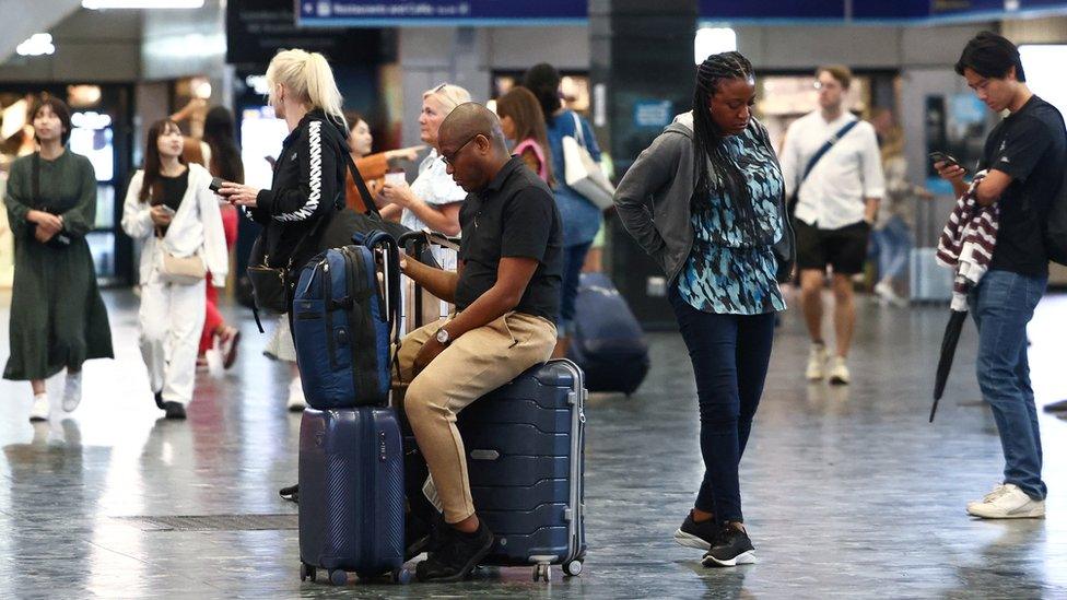 people wait at Euston