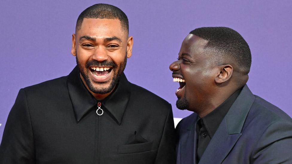 British rapper Kano (L) shares a joke with British co-director Daniel Kaluuya (R) on the red carpet upon arrival to attend the world Premiere of the film "The Kitchen" during the 2023 BFI London Film Festival in London, on October 15, 2023