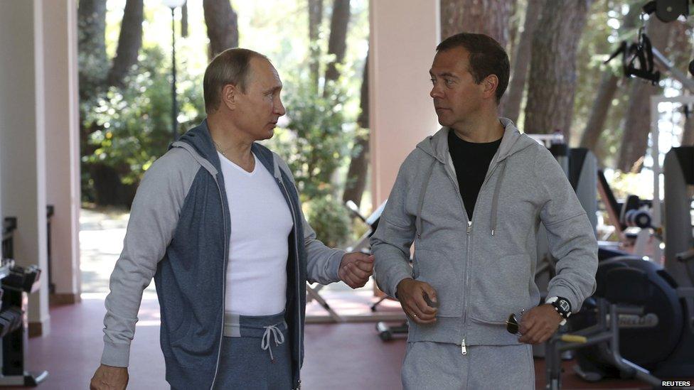 Russian President Vladimir Putin (L) talks with Prime Minister Dmitry Medvedev in a gym at the Bocharov Ruchei state residence in Sochi, Russia, August 30, 2015.