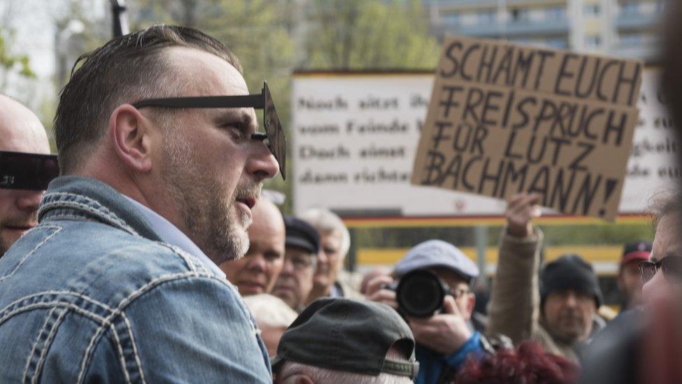 Lutz Bachmann spoke to supporters before entering court (19 April)