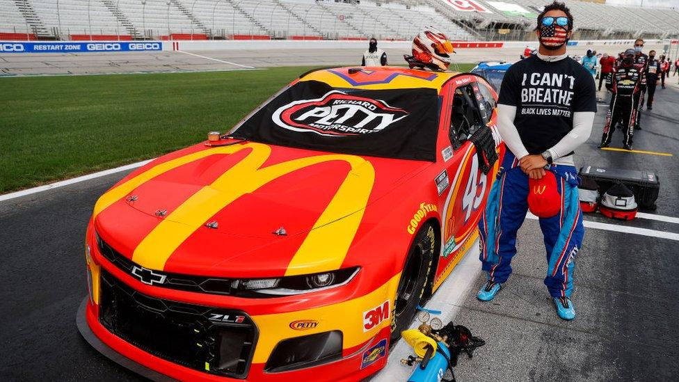 Nascar driver Bubba Wallace wears a Black Lives Matter shirt at the Atlanta Motor Speedway on 7 June