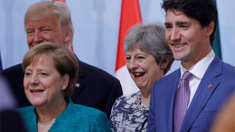 German Chancellor Angela Merkel, Donald Trump, Canadian Prime Minister Justin Trudeau, with Theresa May