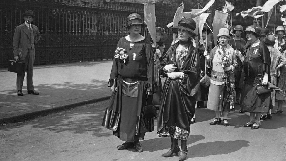 Lady Rhondda (l) marches with Emmeline Pankhurst in London in 1926 calling for universal suffrage for women in the UK