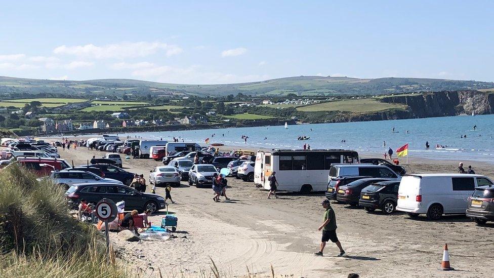 Newport Sands with cars parked on the beach