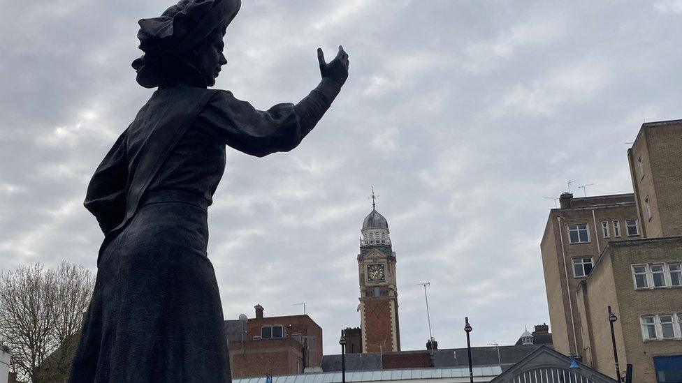 Alice Hawkins statue and the town hall