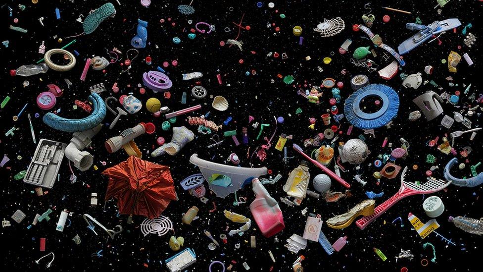 Collection of marine debris against a dark background