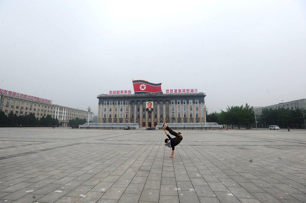 Calvin Sun doing a handstand