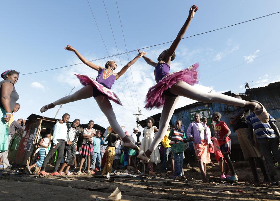 Young ballerinas from different schools perform a dance during a ballet street performance to showcase their skills in Kibera slum, Nairobi, Kenya - Friday 30 November 2018