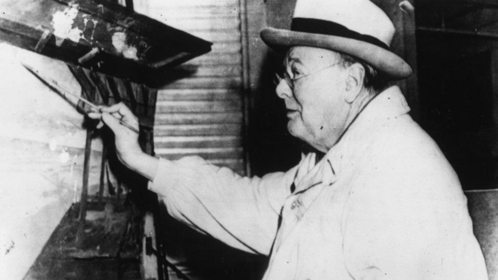 Winston Churchill painting at the easel