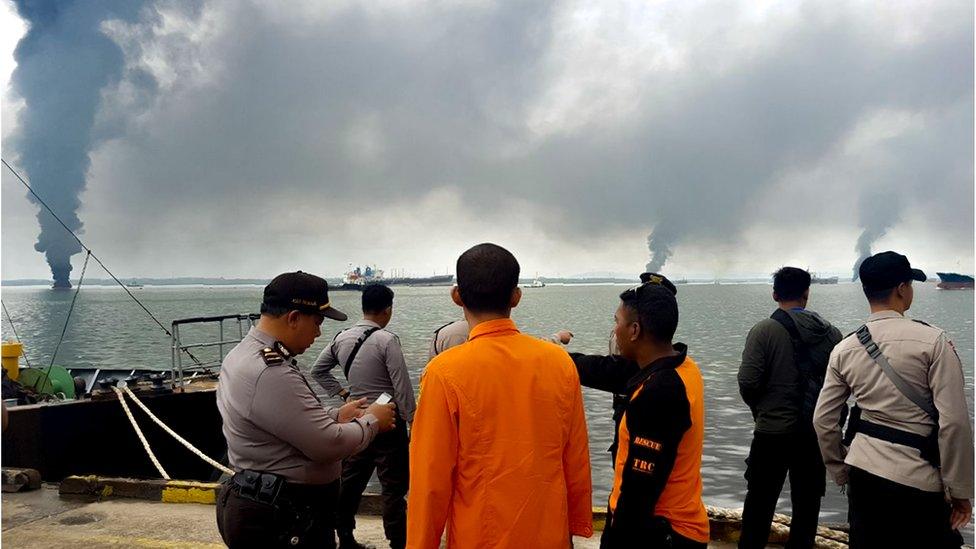 An oil spill clean up operation gets under way in the waters off Balikpapan, Indonesia, March 31, 2018