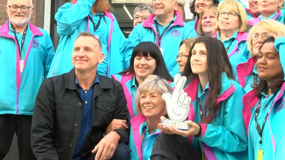 Christopher Ecclestone with the award