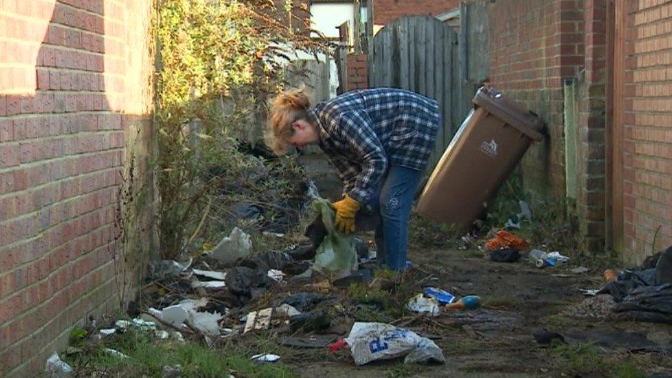 Residents clearing rubbish