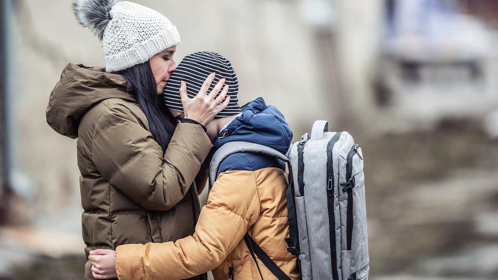 A woman and child refugee