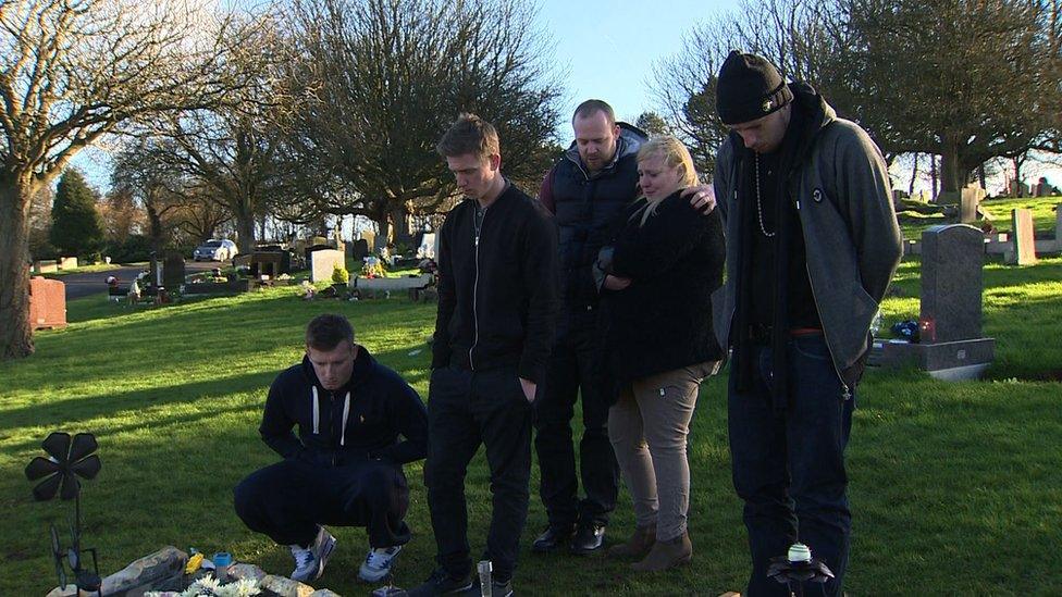 The Luciw family at the grave