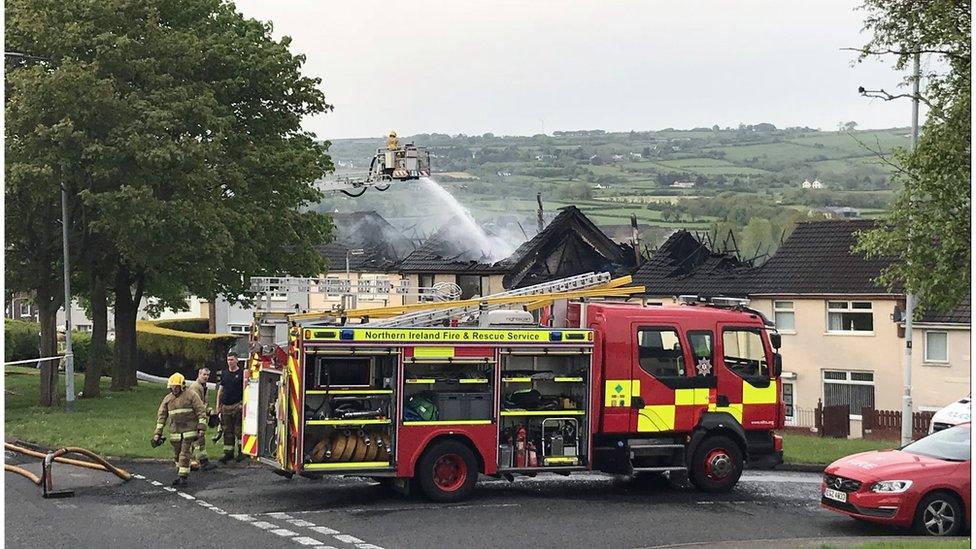 Fire service putting out fire at homes in County Antrim