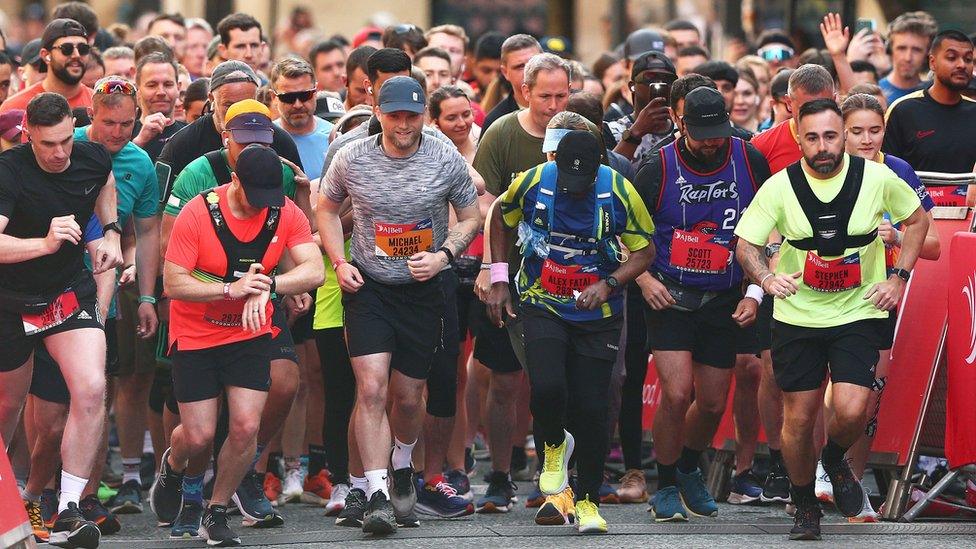 runners race out at starting line