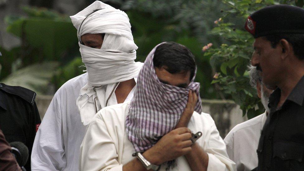 Ex-husband Muhammad Shakeel, center right, and father Muhammad Shahid, center left