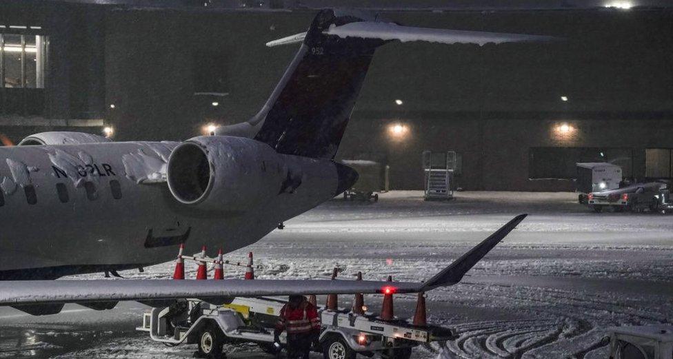 Plane on tarmac in snow