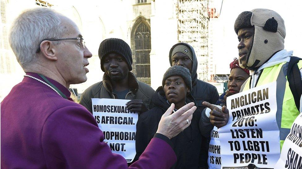 Justin Welby speaks with protesters at Canterbury Cathedral