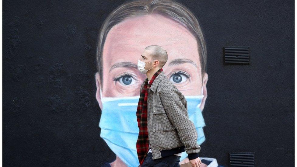 mural of a nurse wearing a mask