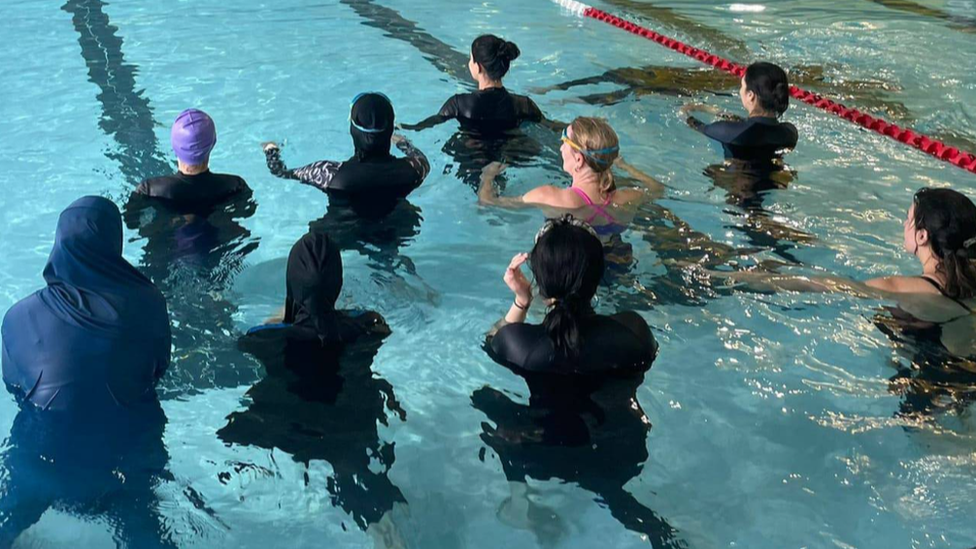 Muslim women in a swimming pool